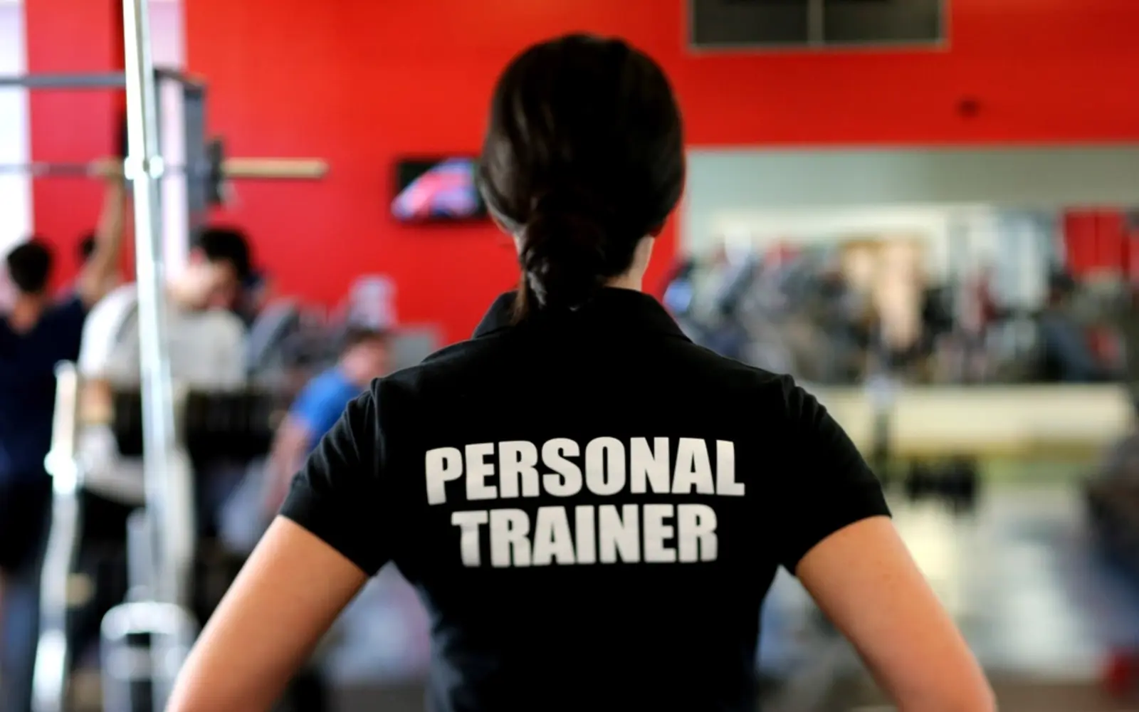 A personal trainer in a gym